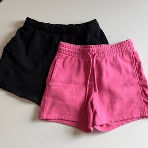 Two Pairs of Aritzia TNA Cozy Fleece Boyfriend Shorts